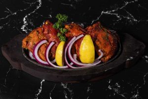 Tandoori Chicken with Slices of Onion and Lime